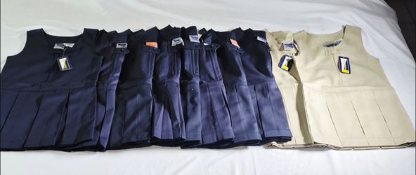 NEW GIRLS UNIVERSAL UNIFORM PLEATED JUMPER DRESS IN  NAVY BLUE OR KHAKI SIZE 4.