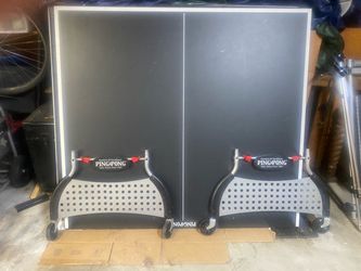 “Ping Pong” brand ping pong table.