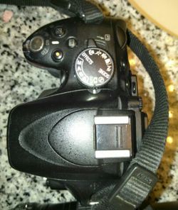 Nikon D5100/Lens AF-S Nikkor DX 18-55mm/Charger/ battery and cords