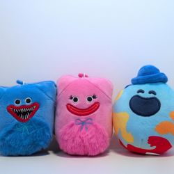 Cute plush set from Poppy Playtime. Has Huggy Wuggy, Kissy Missy, and Doey characters. Soft and cuddly. All new with tags.