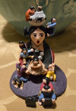 Storyteller Figurine Central female figure surrounded by children.