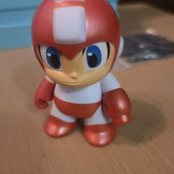Megaman Kidrobot Mini Series 3" metallic red figure. 