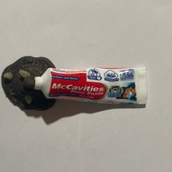 Zuru 5 Surprise Mega Gross Minis "McCavities Poop Paste" collectible toy.  