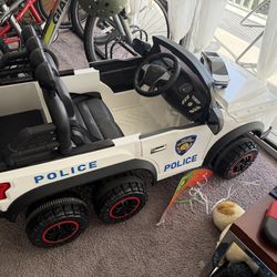 6-Wheel Kids Electric Police SUV Ride-On Car 12V w/ Remote – very good condition