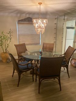 Rattan 5 chair dining room with 52 inch glass good condition.