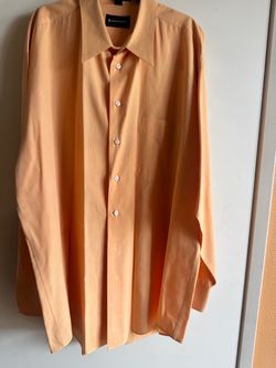 Men cool  long-sleeve dress shirt in a warm orange tone.
