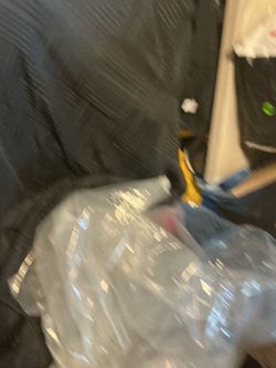 A beautiful , black shower curtain with the plastic for the water