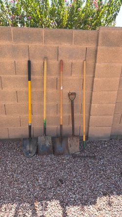 Four shovels and a rake selling altogether