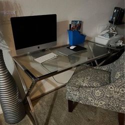 glass desk and fabric sofa