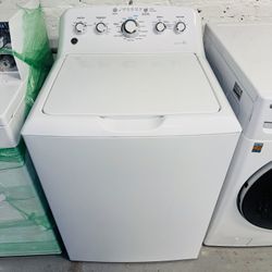 GE white washing machine, includes a receipt with a 60-day warranty.