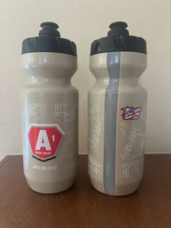 2 Beige Specialized water bottles