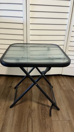 Folding glass patio table