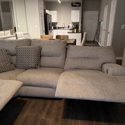 Large grey reclining couch with 3 electric reclining chairs.