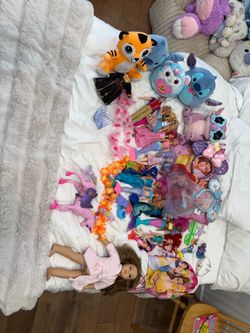 Barbies and stuffed animals and other girl toys