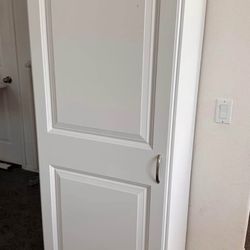 Tall white storage cabinet