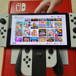 NINTENDO SWITCH OLED *MODDED* with 100 GAMES MARIO PARTY,POKEMON,ZELDA,MINECRAFT,MARIO KART and Many More