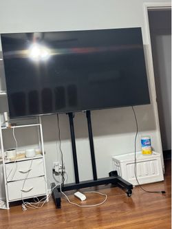 Samsung 65” 4K Smart TV + Rolling TV Stand – $150