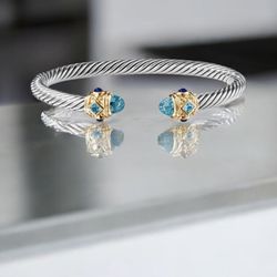 David Yurman Blue Topaz And Gold Ends Size Med/large. 7 Mm 