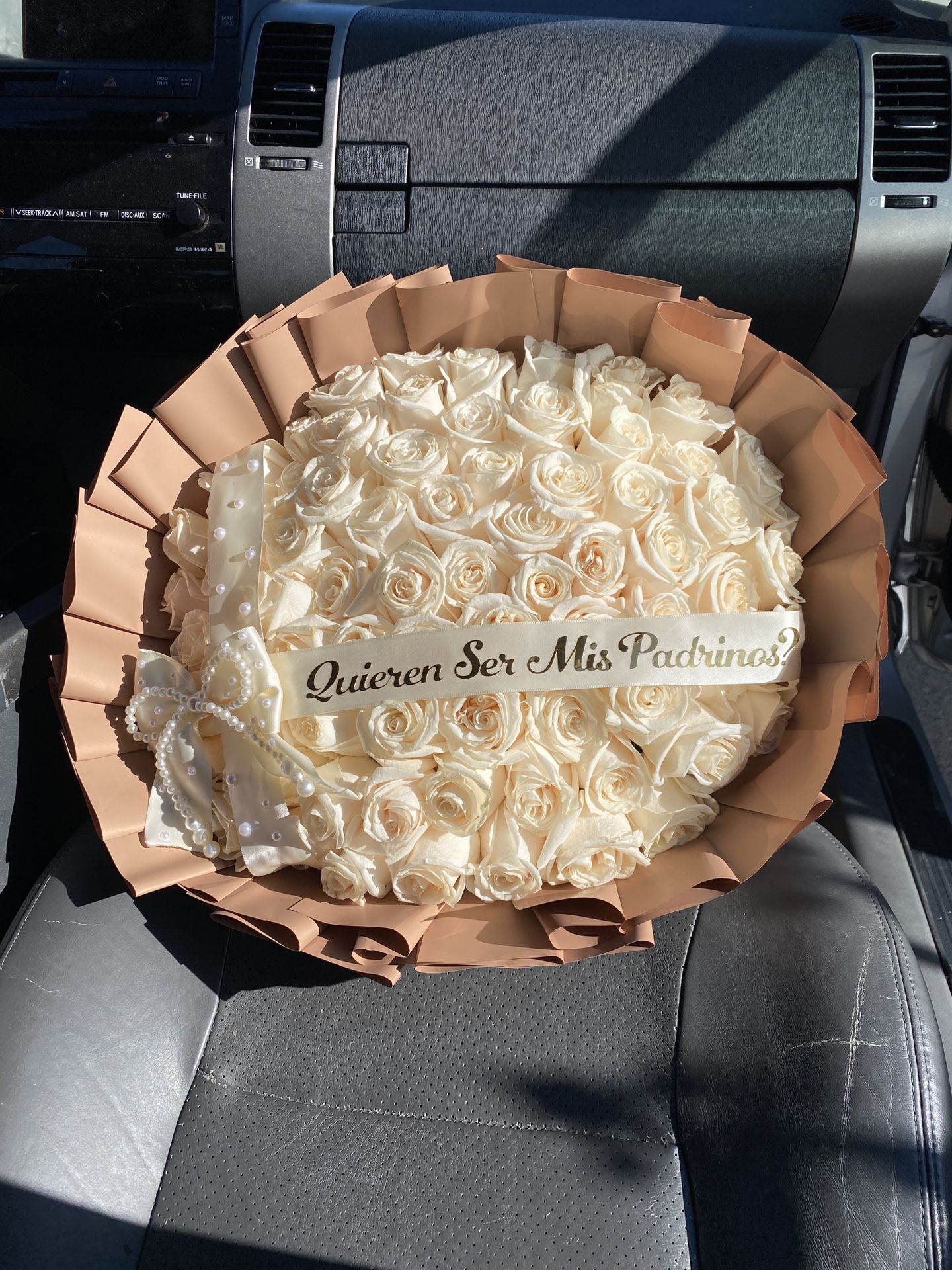 75 white roses 