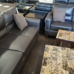 Dark brown traditional pinhead faux leather sofa and loveseat