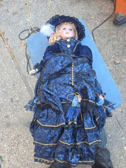 Porcelain Collector Doll in Blue Victorian Dress.. like new and the price is firm