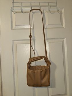 Tan and brown leather crossbody Purse bag with adjustable strap and zipper closure 