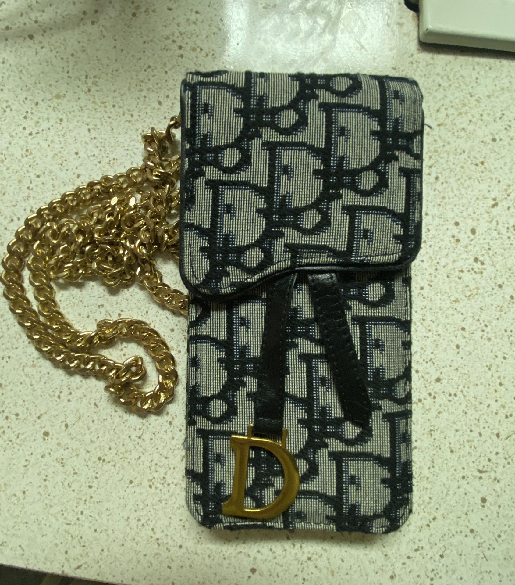 Dior phone bag is a very similar copy