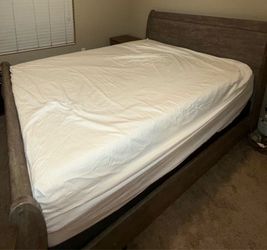 Bed with mattress and night stand