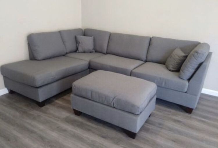 New in box grey sectional ottoman included// reversible L/R chaise