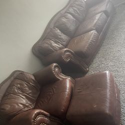 1 leather Couch, And One Leather Chair plus Foot Rest. 