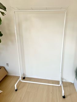 Garment rack with shelf, on wheels