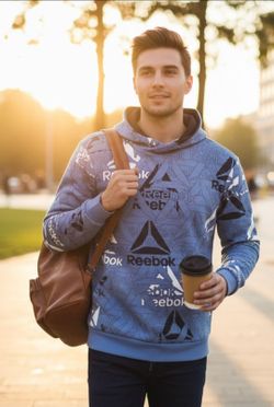 Reebok Size XL Blue Unwind Pullover Hoodie All-Over Logo Pattern W/Hand Pockets Excellent Condition. This is a Reebok Unwind hoodie in blue with an al