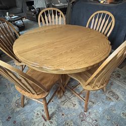 Solid Oak Pedestal Dining Table w/24" Leaf and 5 Arrowback Chairs by America Furniture