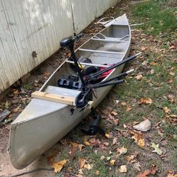 boat with oars and motor and two life jackets
