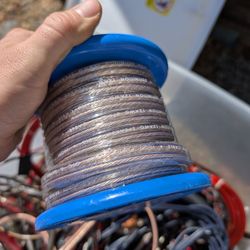 Box full of speaker wire, RCA cable, and amp cables