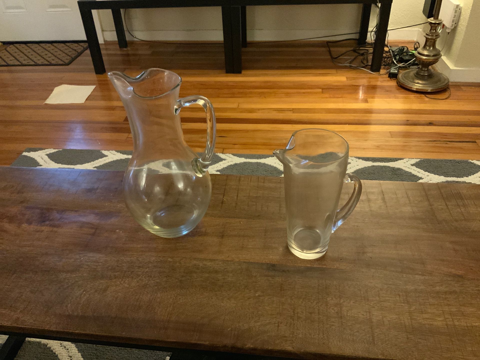 Two glass serving pitchers