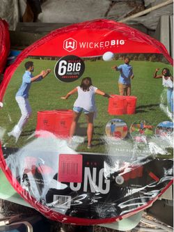 giant yard pong game. new comes with 6 giant cups a ball and pump