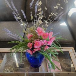 Two Flower Arrangements  With Vases