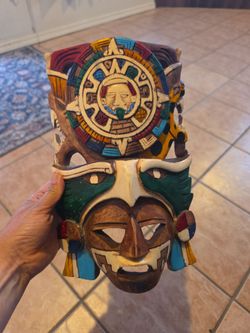 Mexican Mayan calendar mask is a decorative wooden wall art piece