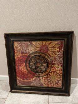 Decorative Dark-Toned Framed Wall Art Piece featuring a central medallion