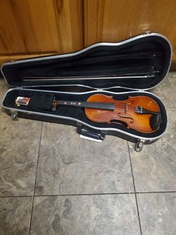  4/4 violin labeled "Antonius Stradivarius" and "Made in Germany