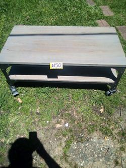 Table with steel frame and wheels