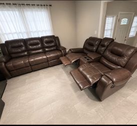 Brown couch and loveseat