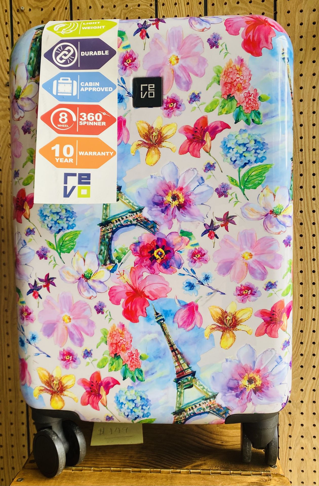 Revo 20-inch carry-on suitcase with a floral print and Eiffel Tower design.