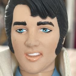 Elvis Presley Barbie doll from the 2021 Barbie Signature Music Series. It features Elvis in a white jumpsuit inspired by his "American Eagle" costume,