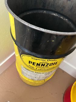 2 penzoil barrels, one from 2004 and the other 1976