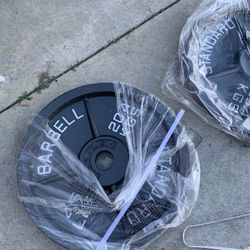 Very nice looking Brand new 45 and 35 lb Olympic weight plates.  Pair of 45s =$120 Pairs of 35s=$100