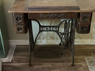 Antique Singer sewing machine and cabinet
