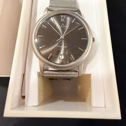 4. Skagen titanium watch, ultra- slim design, model number, dark gray or black dial, and a titanium mesh band.  Model : 170LTTM- New In Box