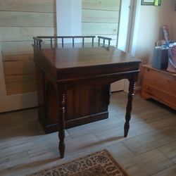 Very old desk with book shelf